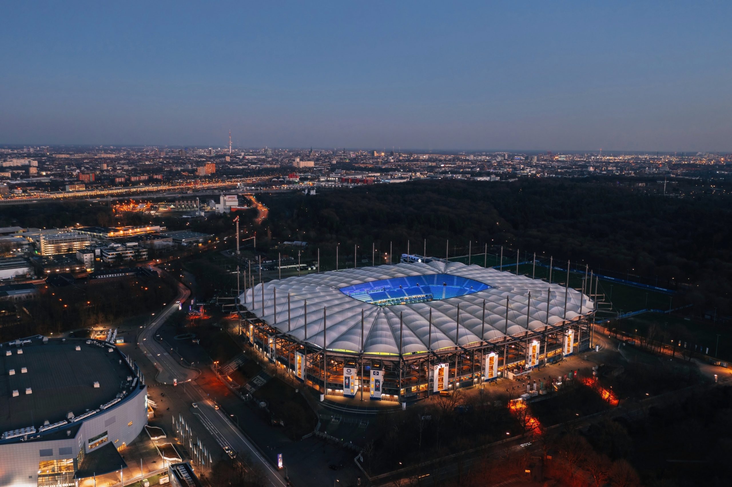 Aerial night view over the illuminated Volksparkstadion