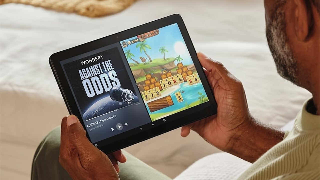 Person using an Amazon Fire HD 10 tablet