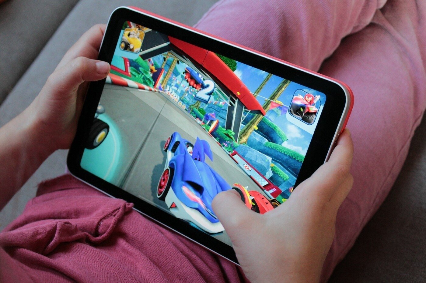 Child playing a racing game on iPad mini 5