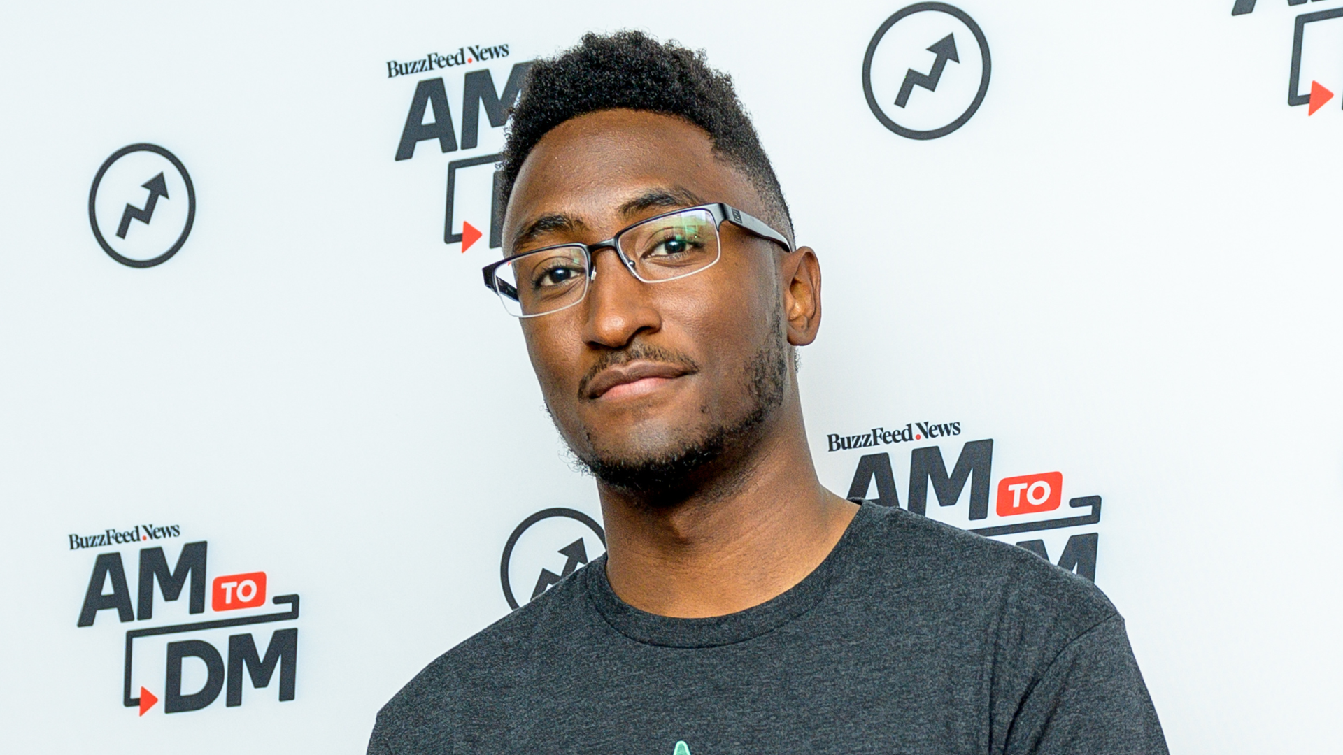 Marques Brownlee in glasses and a gray shirt.