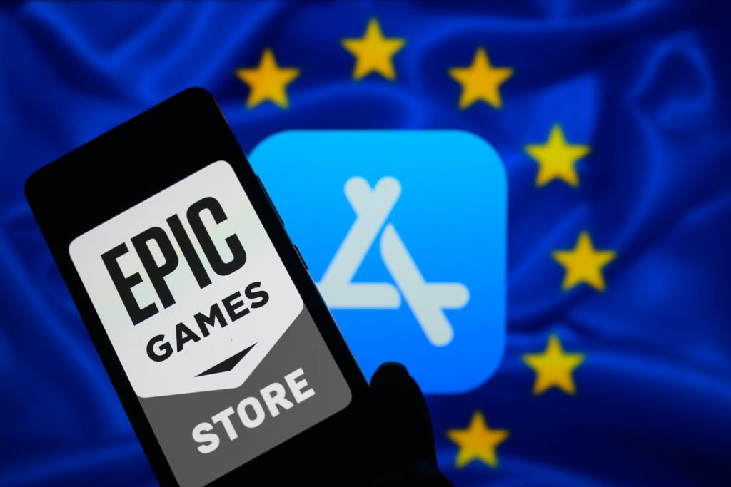 Epic Games Store logo on phone screen in front of Apple App Store logo