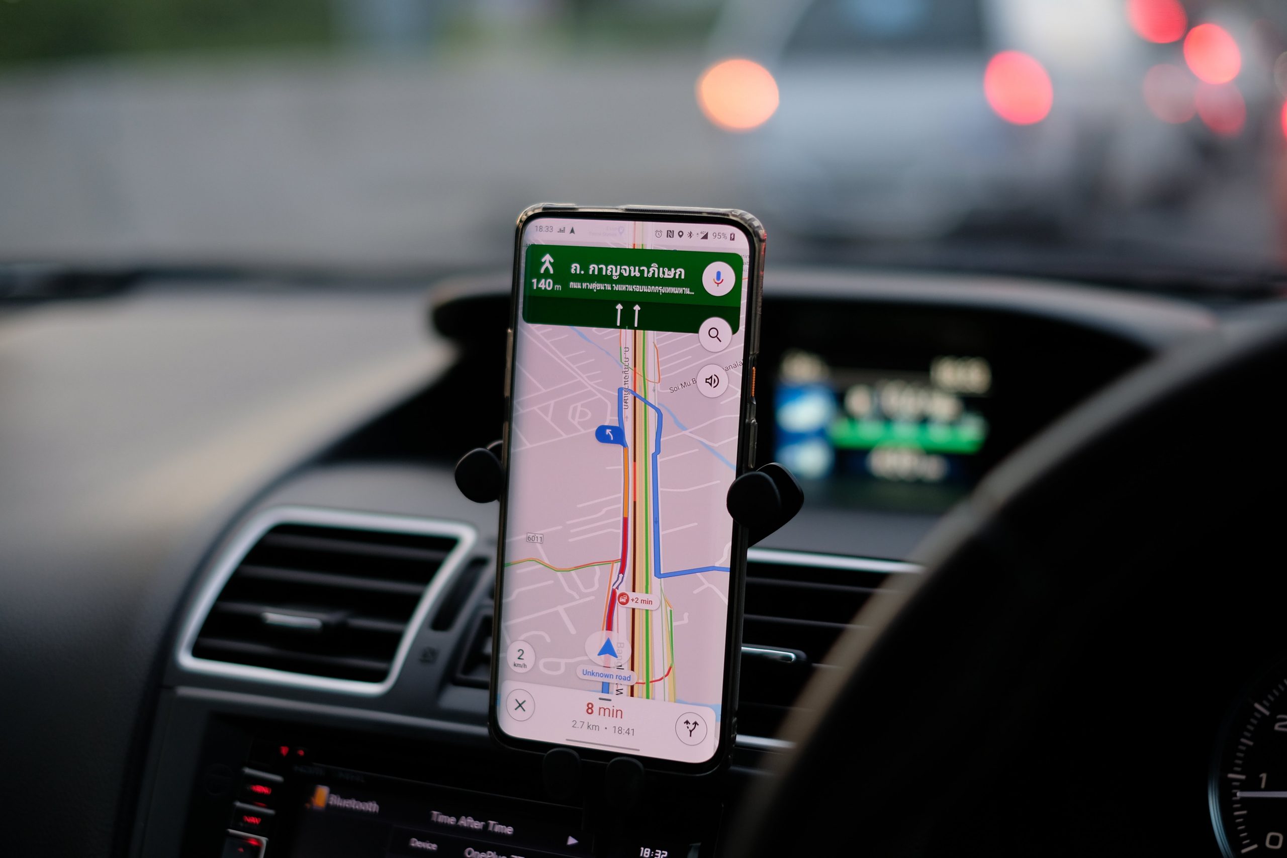 Google Maps on a phone that is attached to a car dashboard