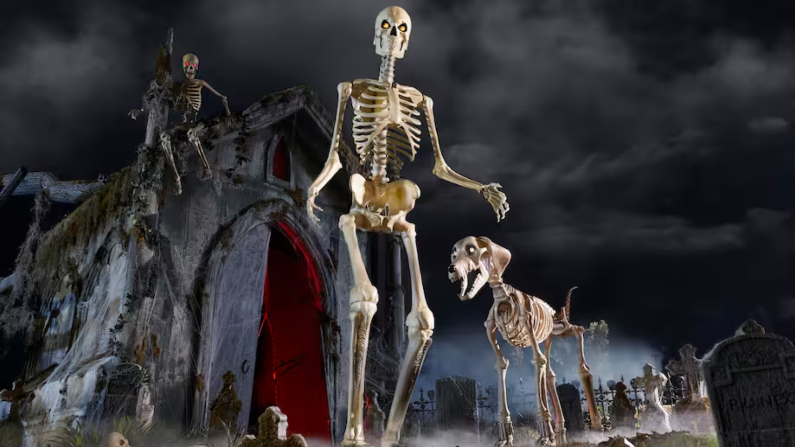 the 12-foot home depot skeleton next to its 7-foot skelly's dog in a spooky setting