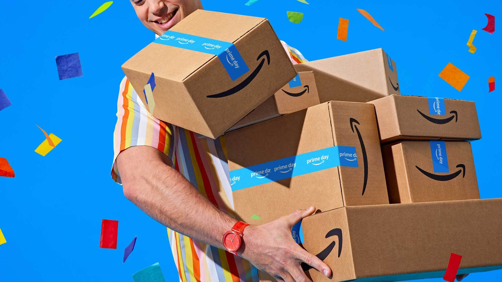 a man holding amazon boxes against a blue background filled with confetti