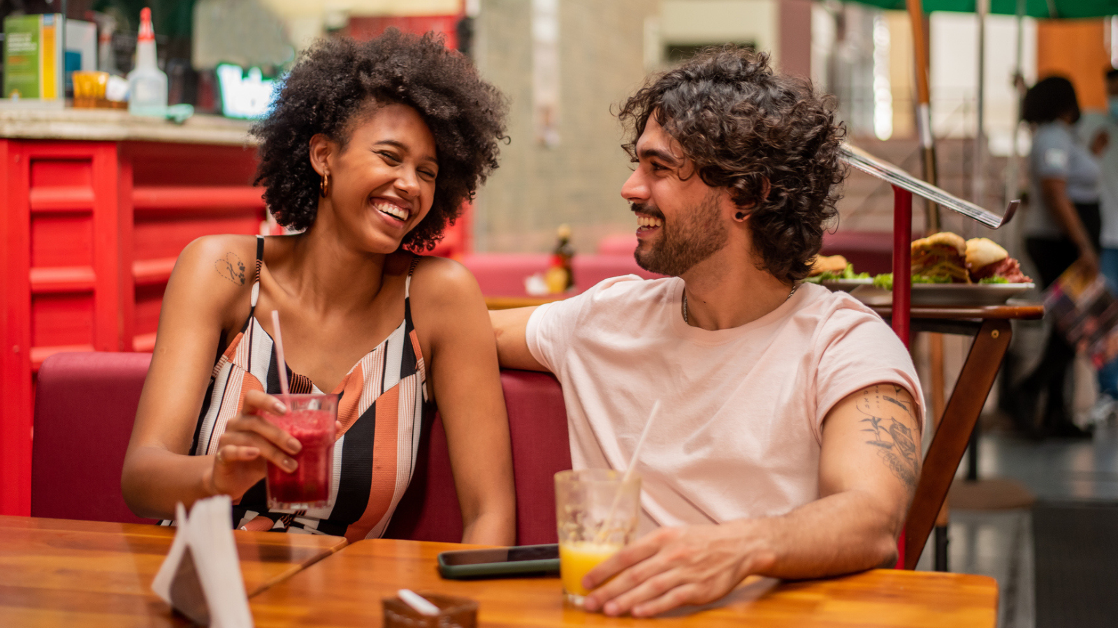 Couple drinking juice at restaurant - stock photo