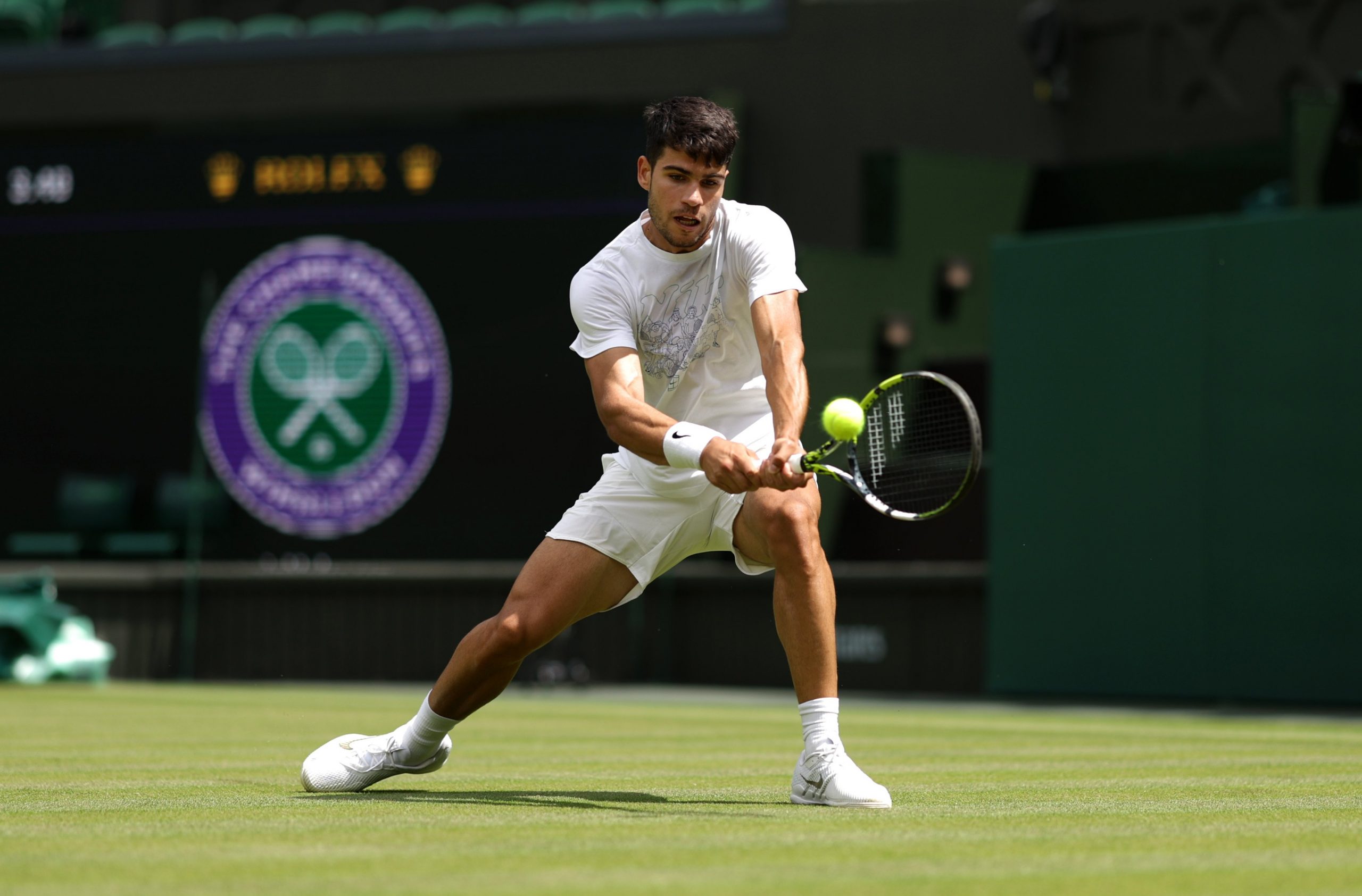 Carlos Alcaraz of Spain plays a backhand