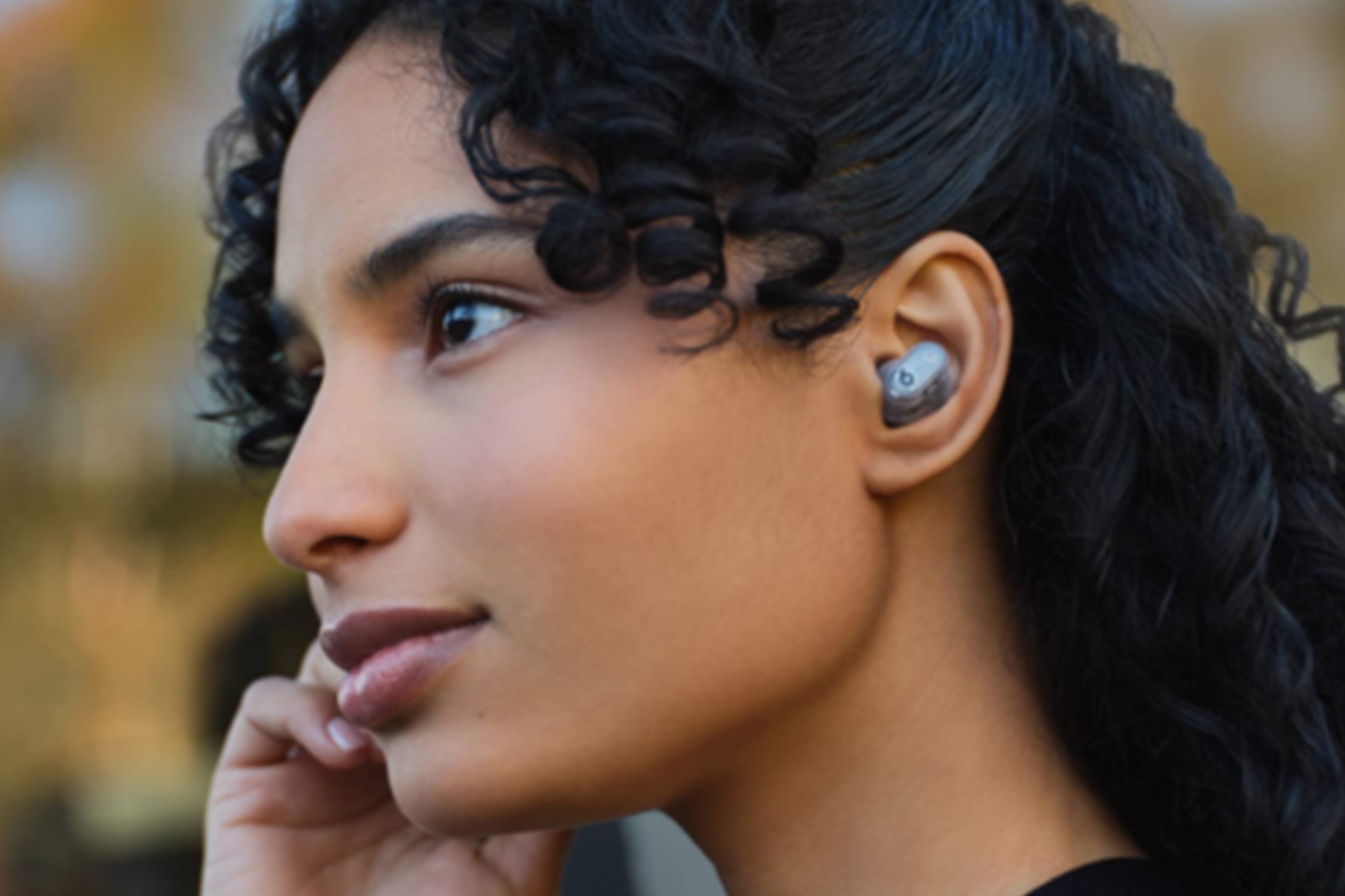 Women listening to music with wireless buds