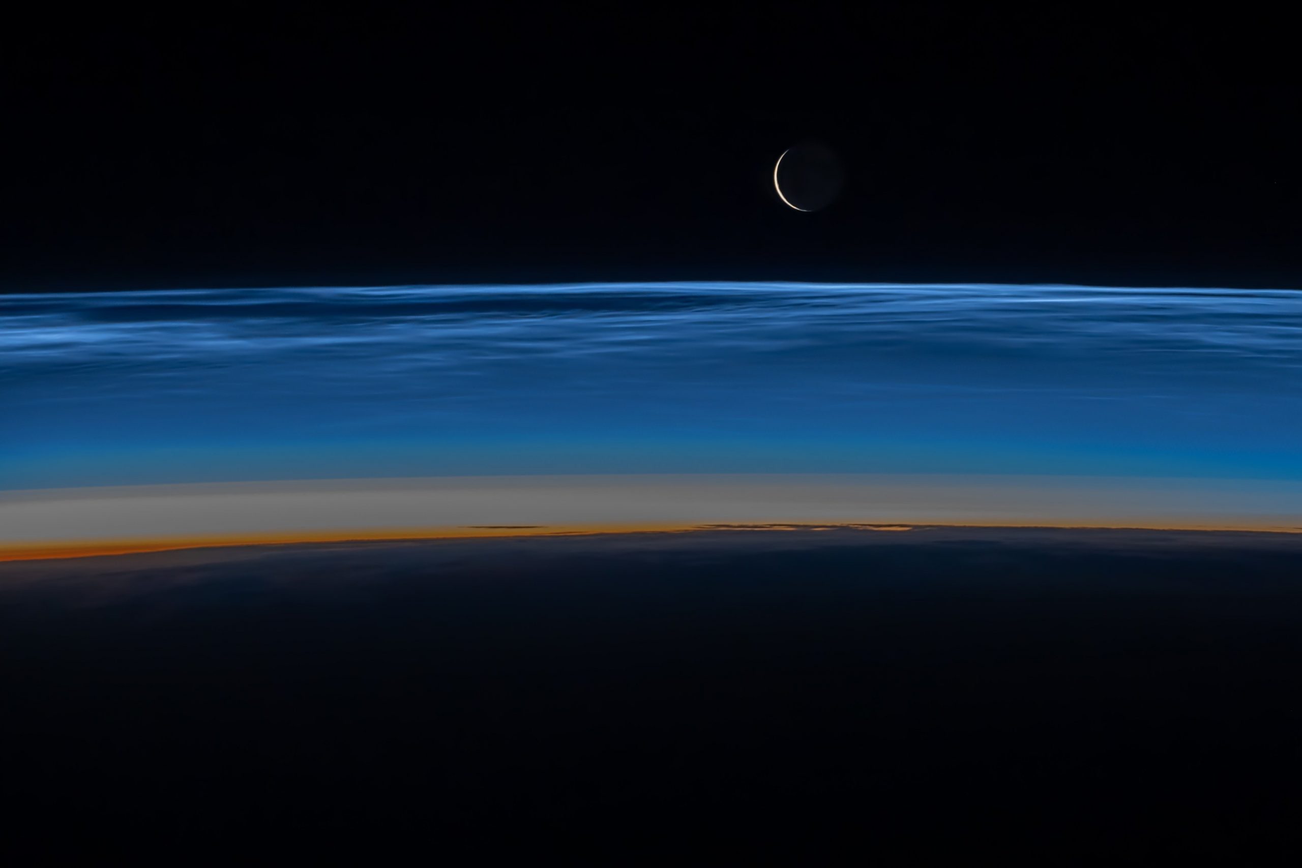 Noctilucent clouds hovering over Earth