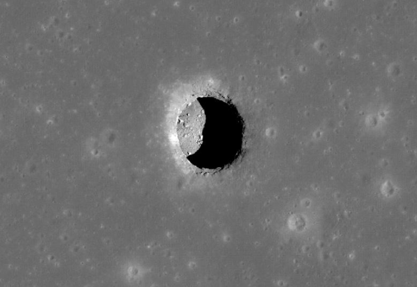 A pit, leading to a cave, in the Mare Tranquillitatis region of the moon.