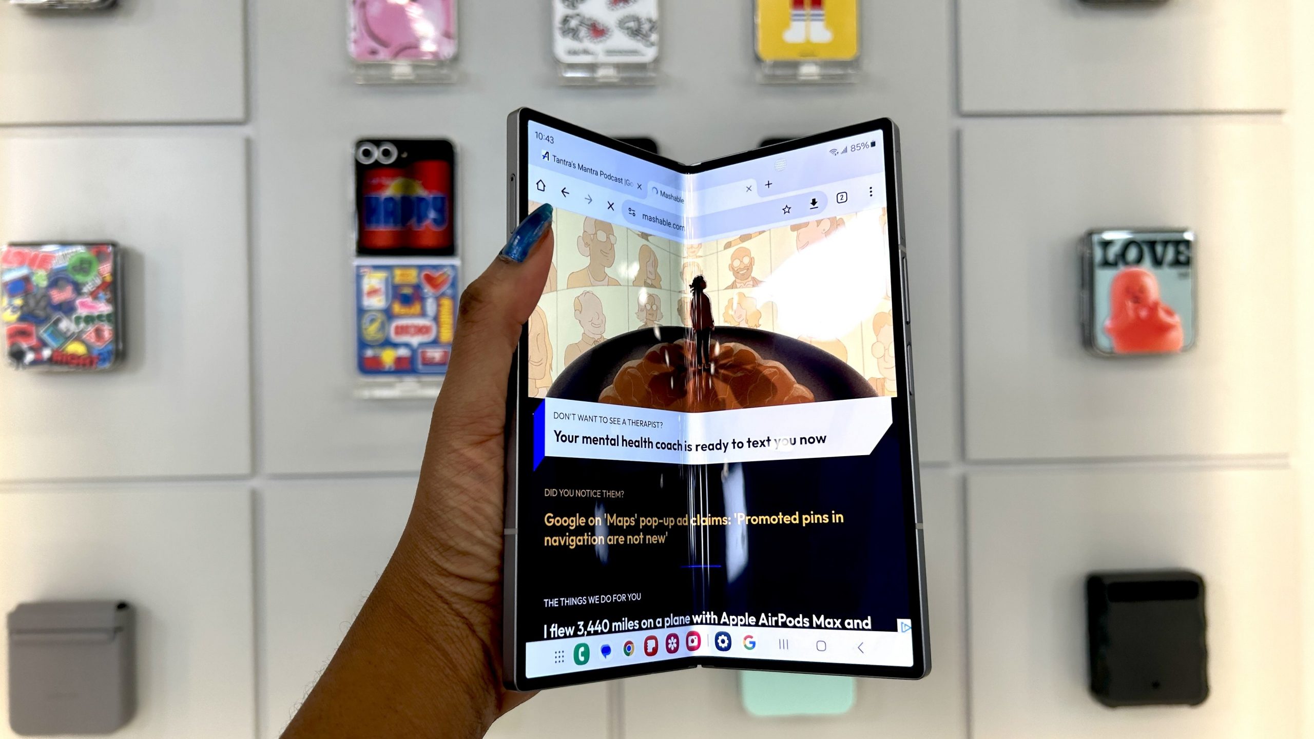 A woman holding the Samsung Galaxy Z Fold 6