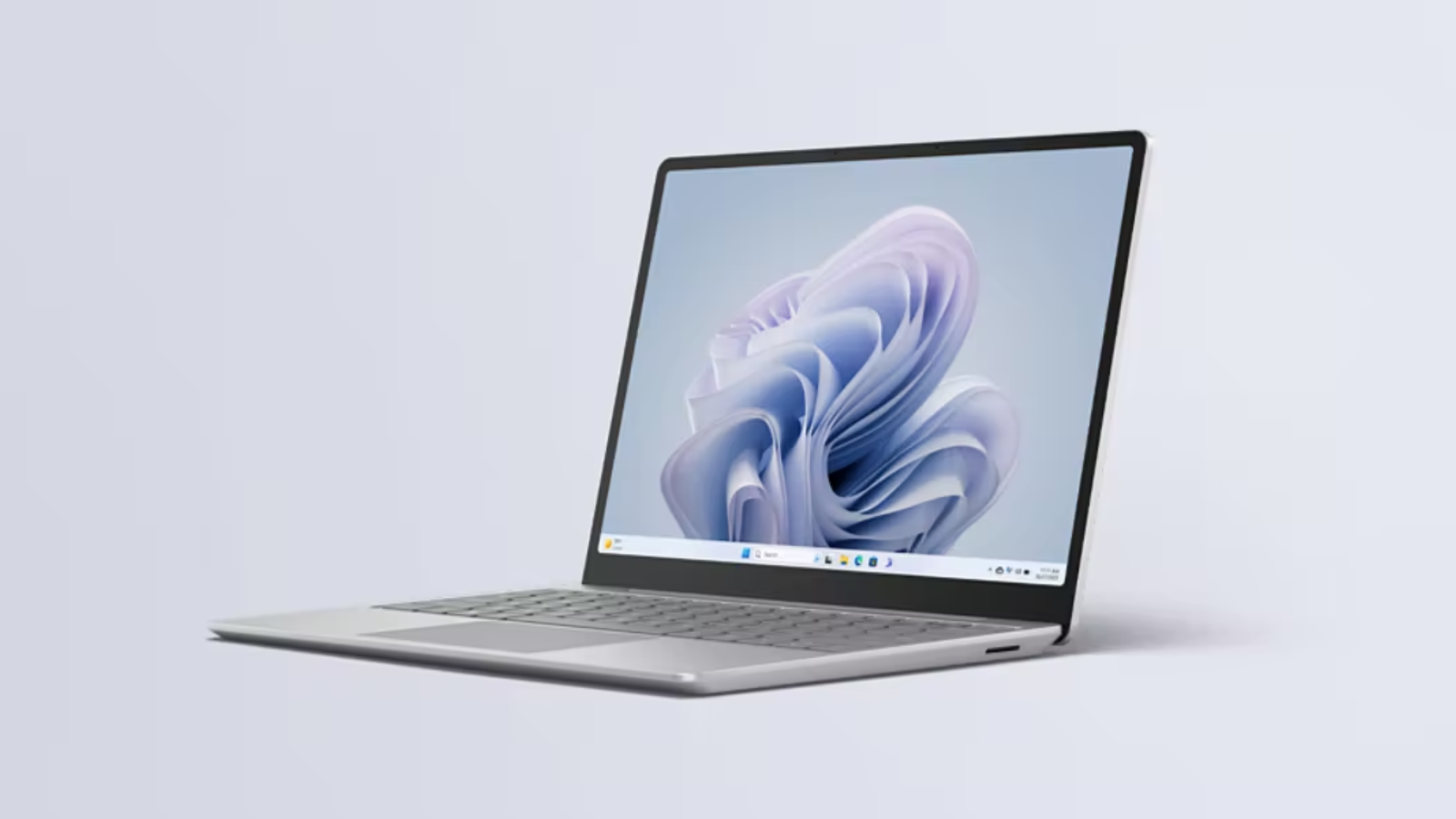 the microsoft surface laptop go 3 against a pale blue background