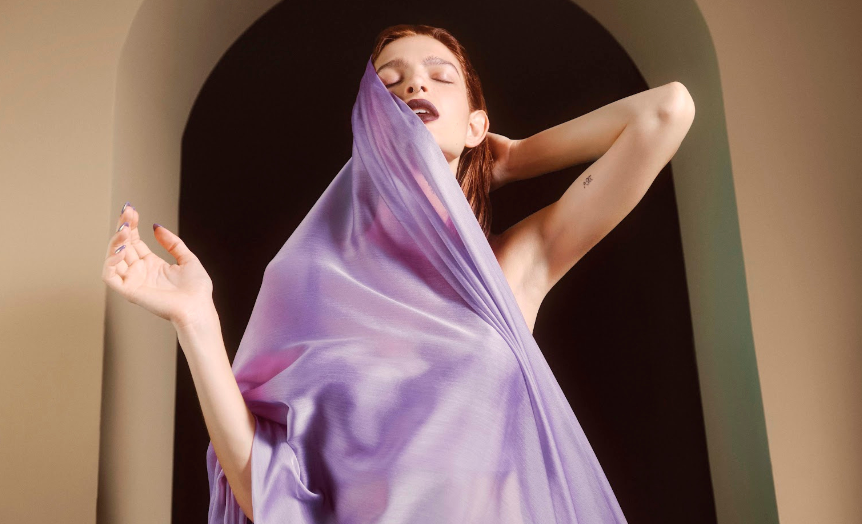 woman in a sheer purple blanket 