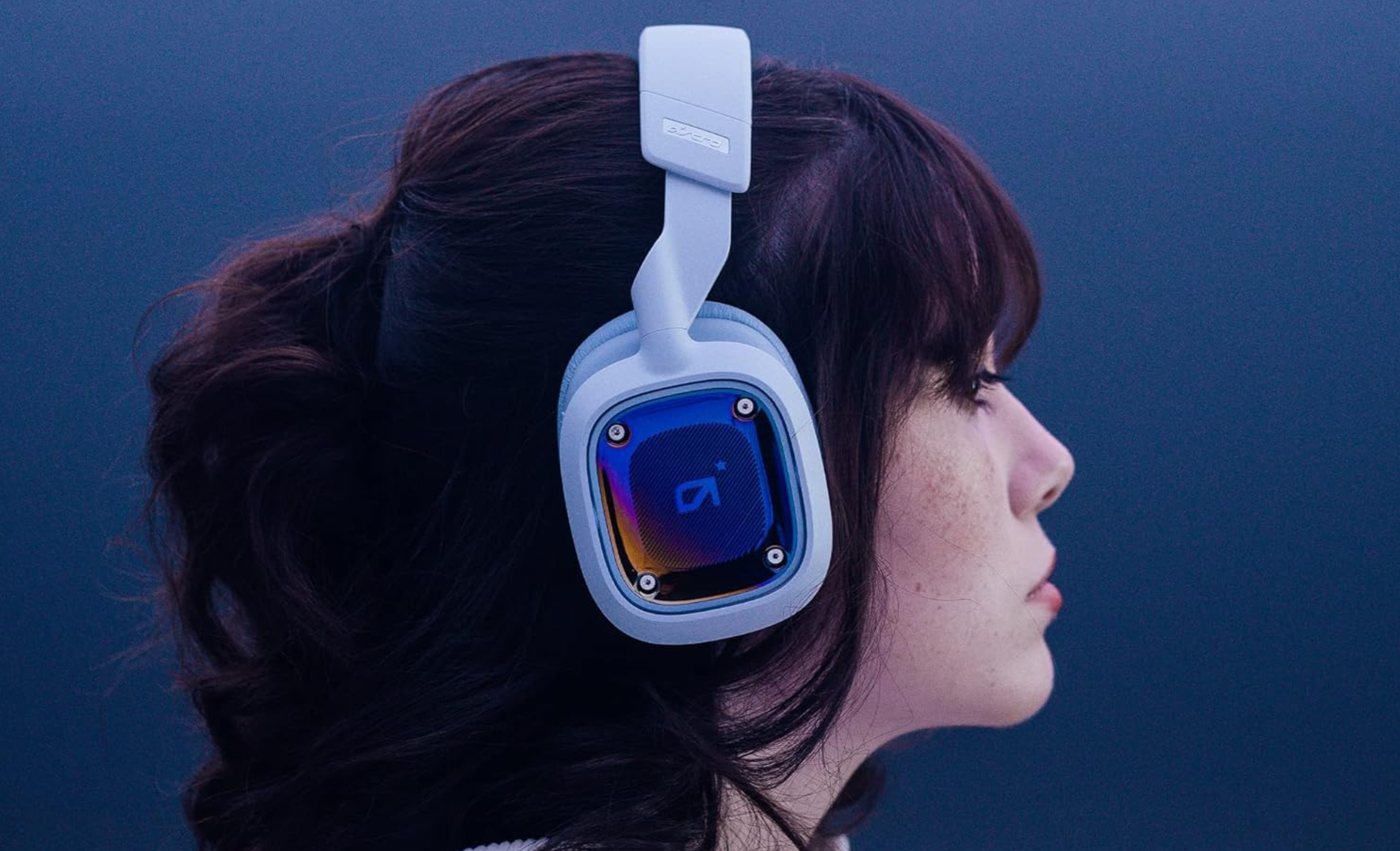 Girl wearing white logitech gaming headset 