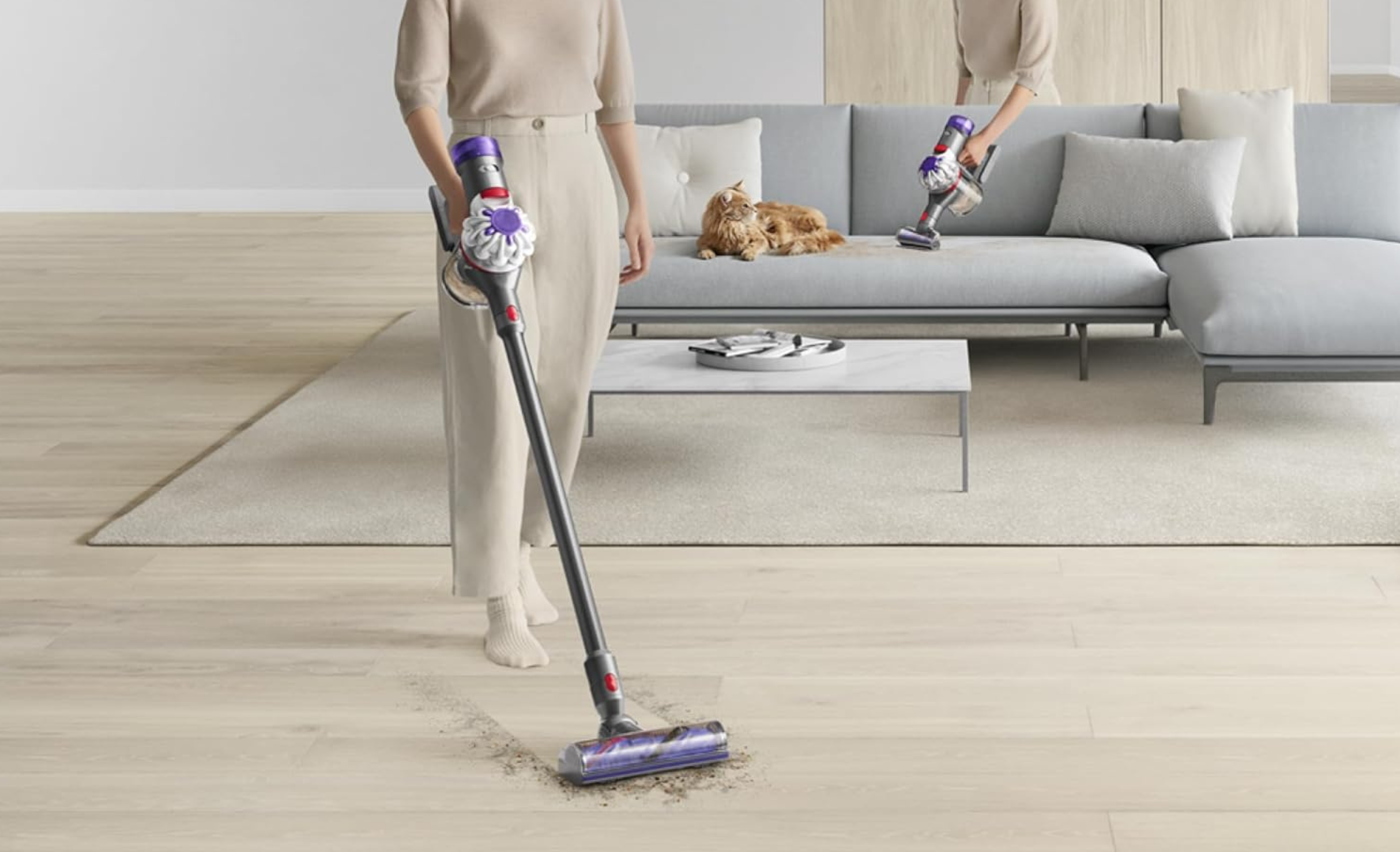 woman using dyson v8 in the living room 