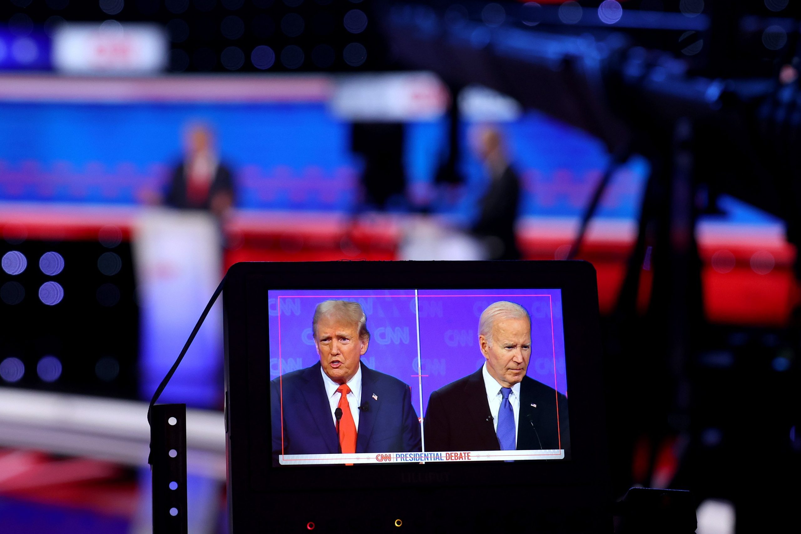 A monitor shows a camera view of the two presidential candidates during the July debate.