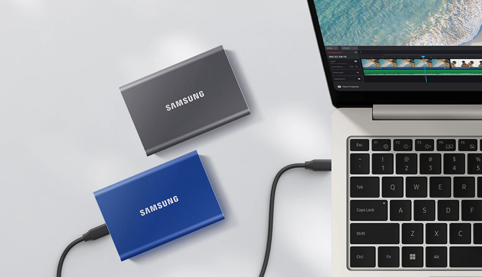 Two Samsung T7 SSDs on a white background, with one connected to a laptop