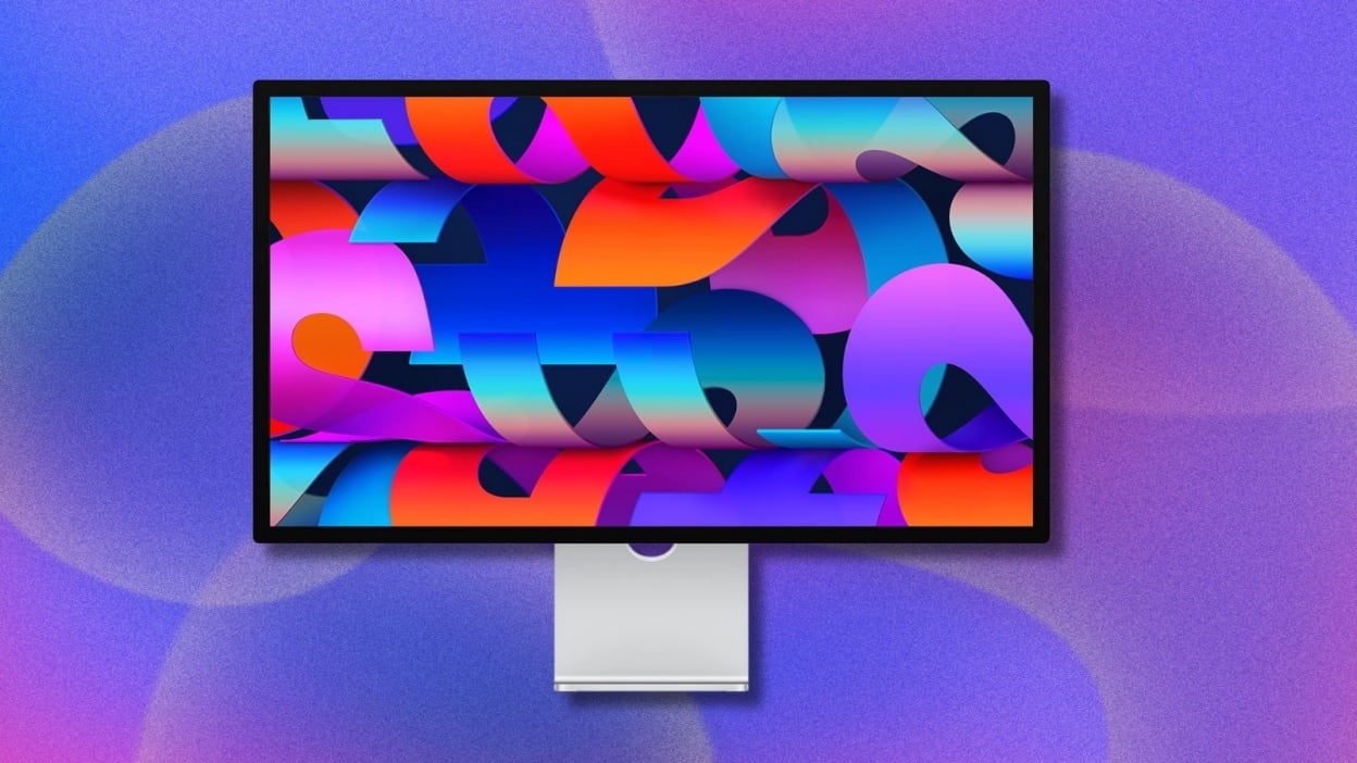 apple studio display with purple background