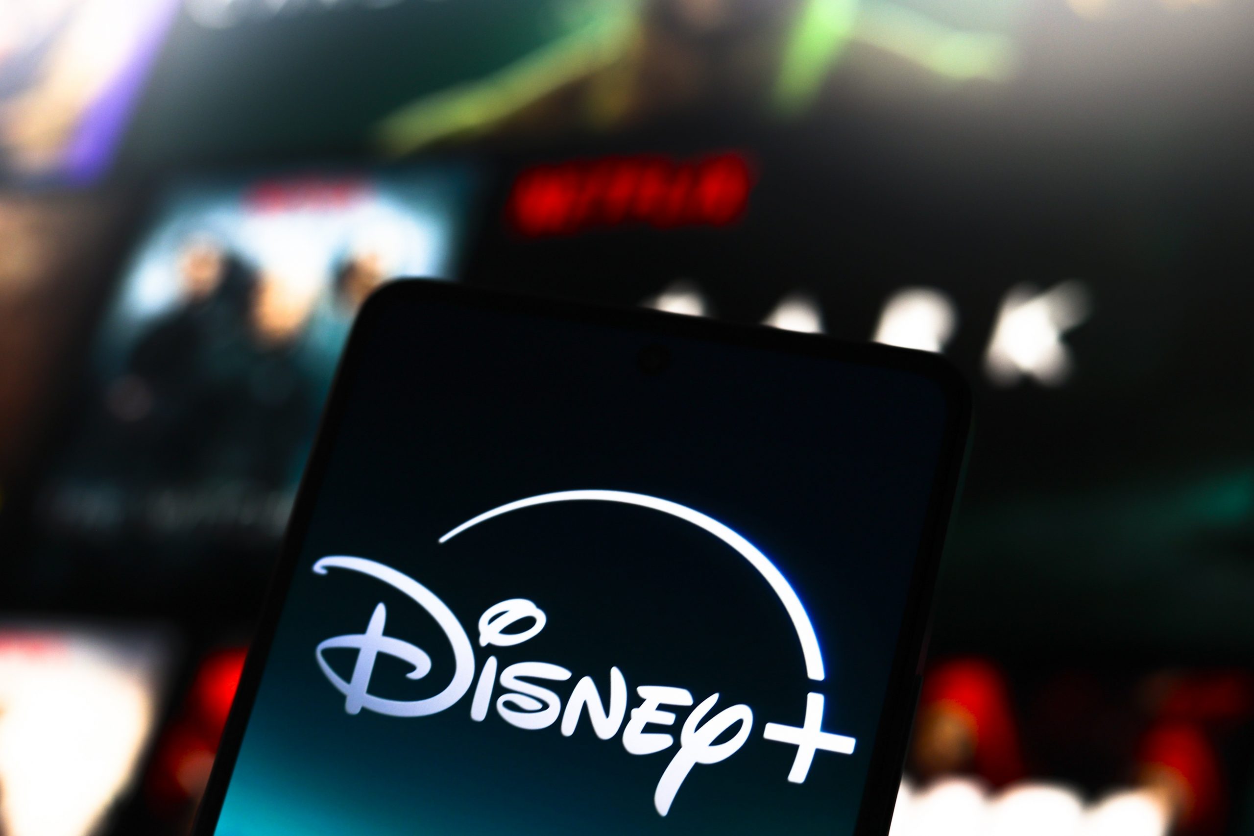 The Disney Plus logo is displayed on a smartphone screen