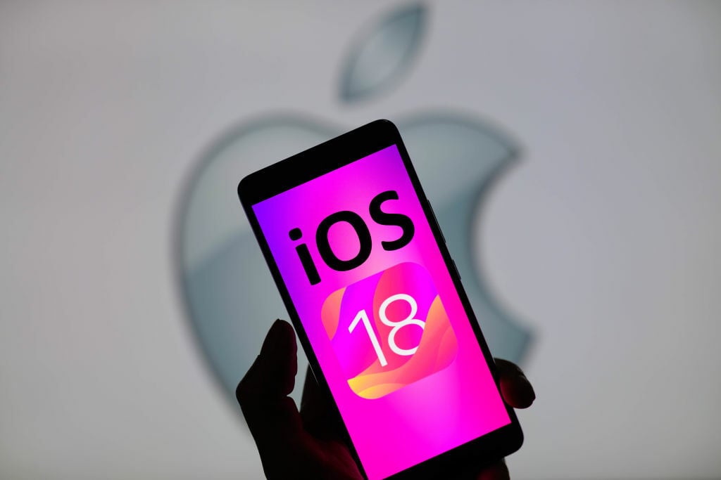 iOS 18 logo on iPhone screen