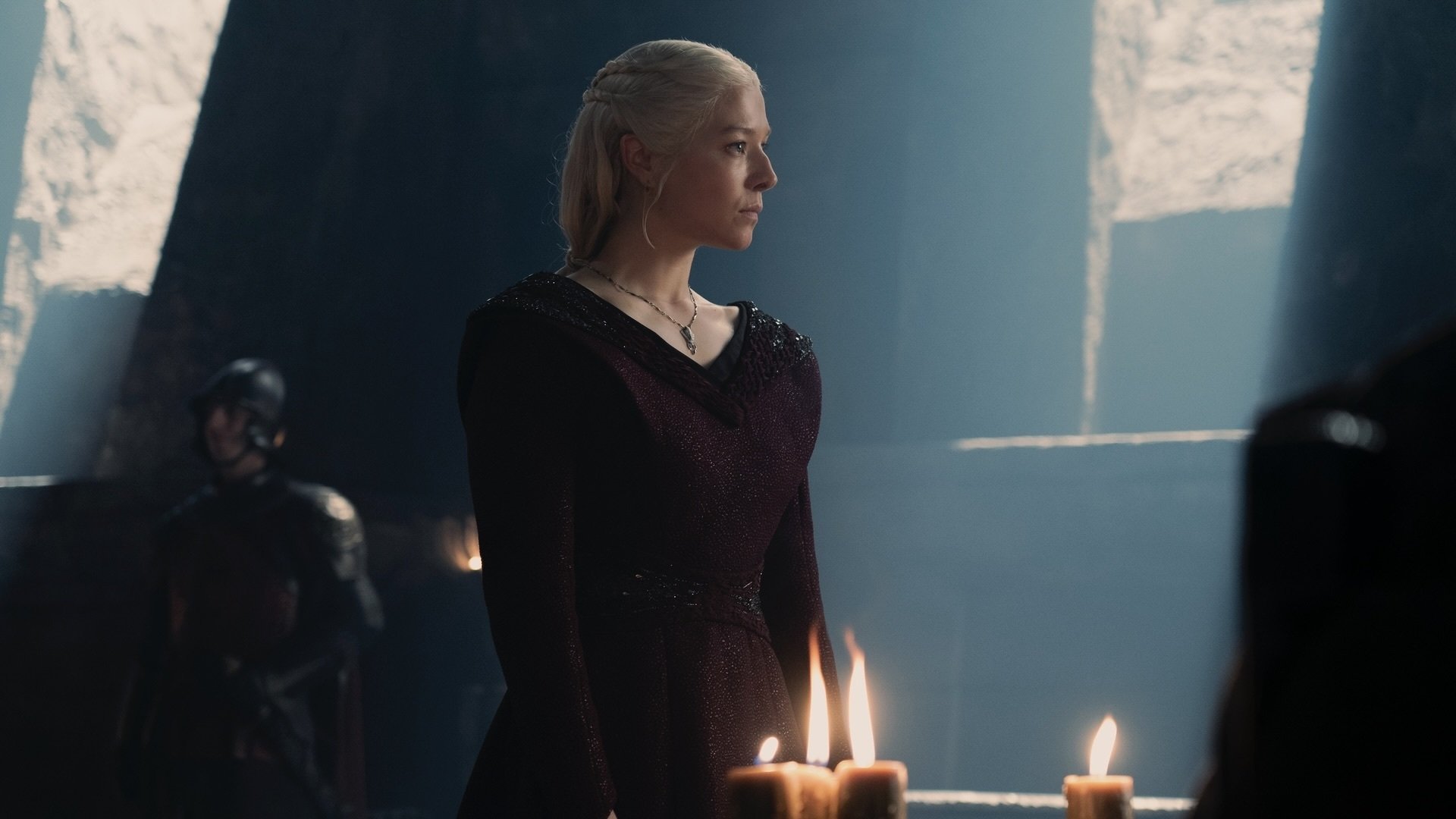 Rhaenyra Targaryen wearing a red gown.