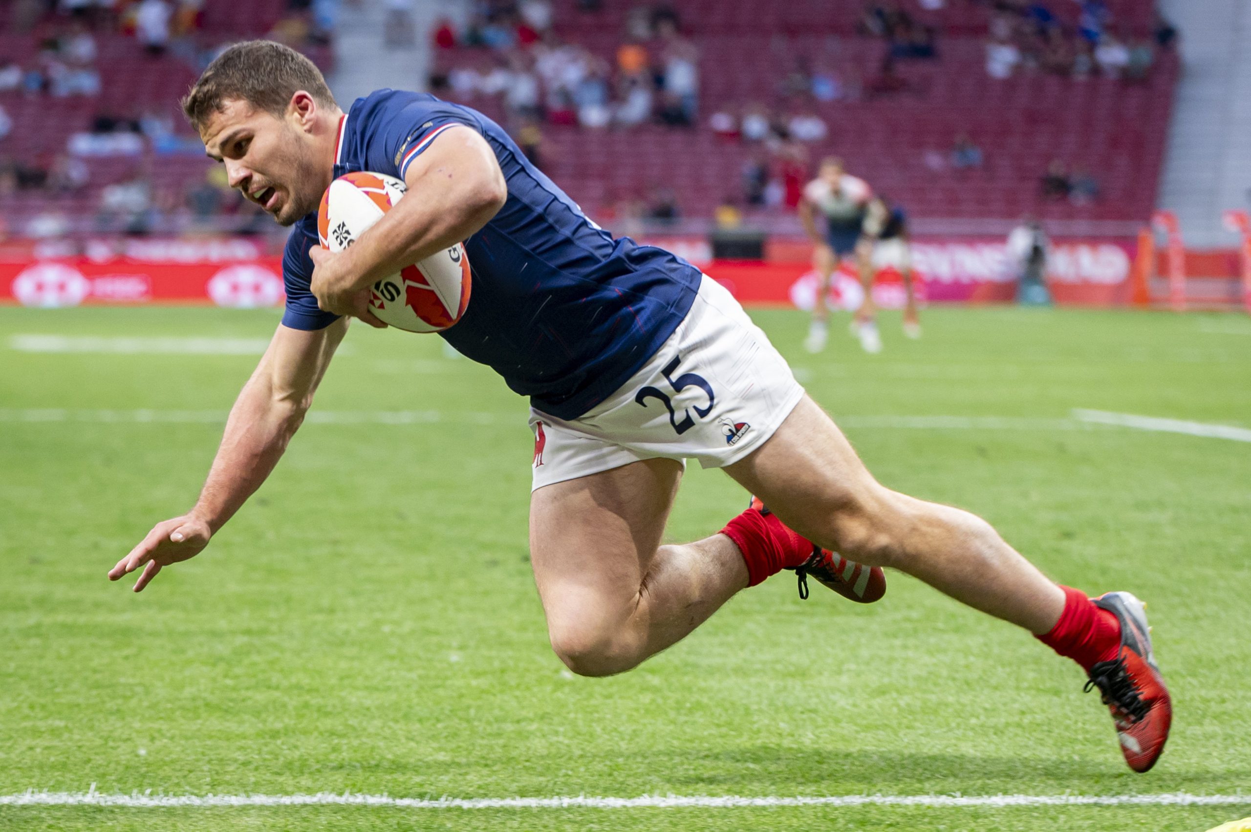 Antoine Dupont scores a try during rugby sevens