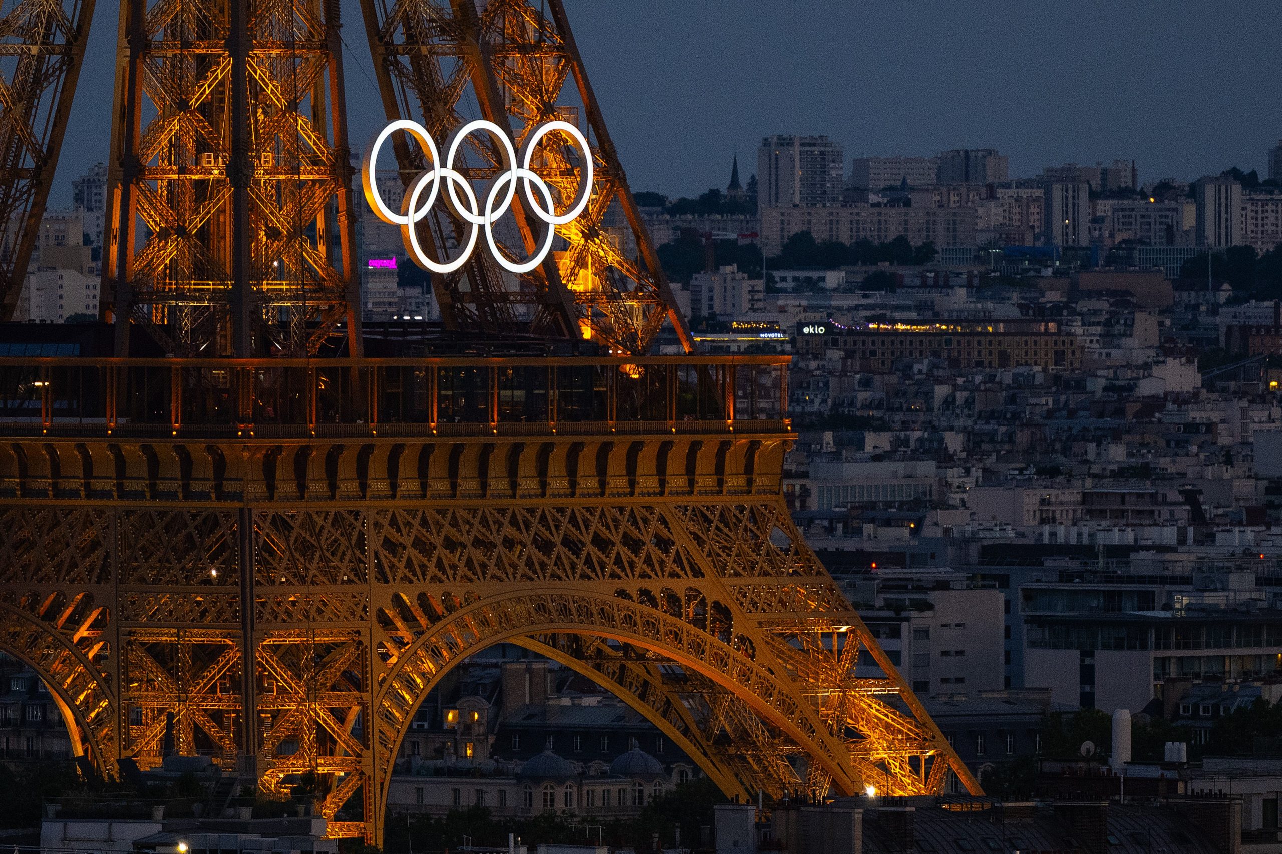 The Eiffel Tower lit up with the Olympic rings.