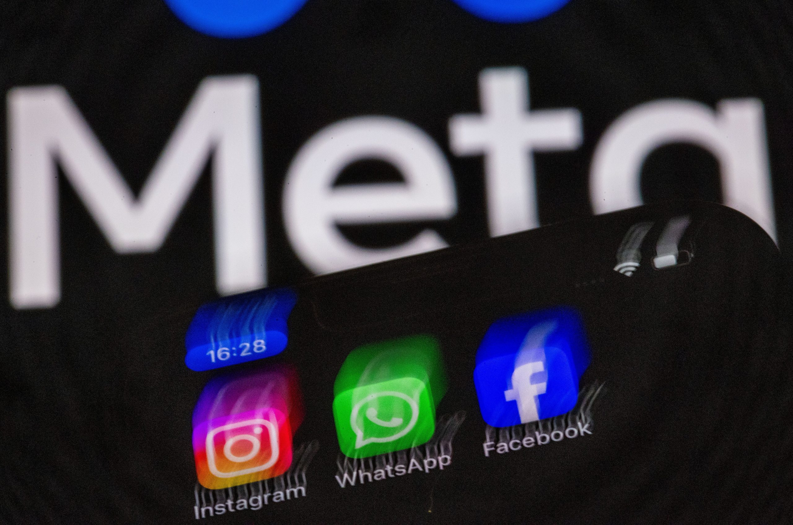 Facebook, WhatsApp, and Instagram apps under Meta logo