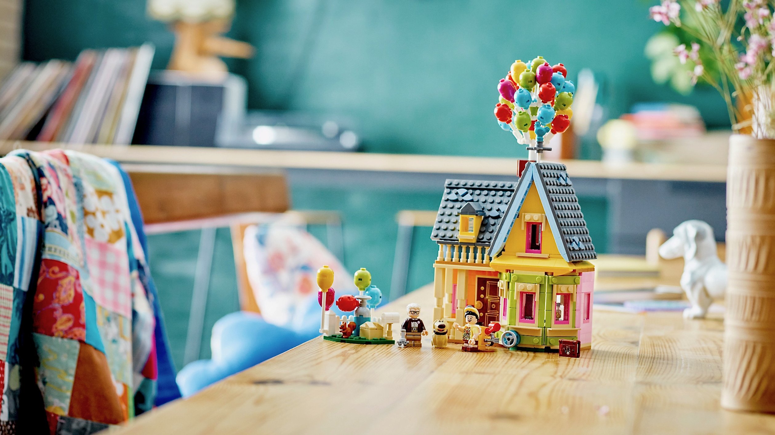 Lego model of the Pixar 'Up' house sitting on a table in a home