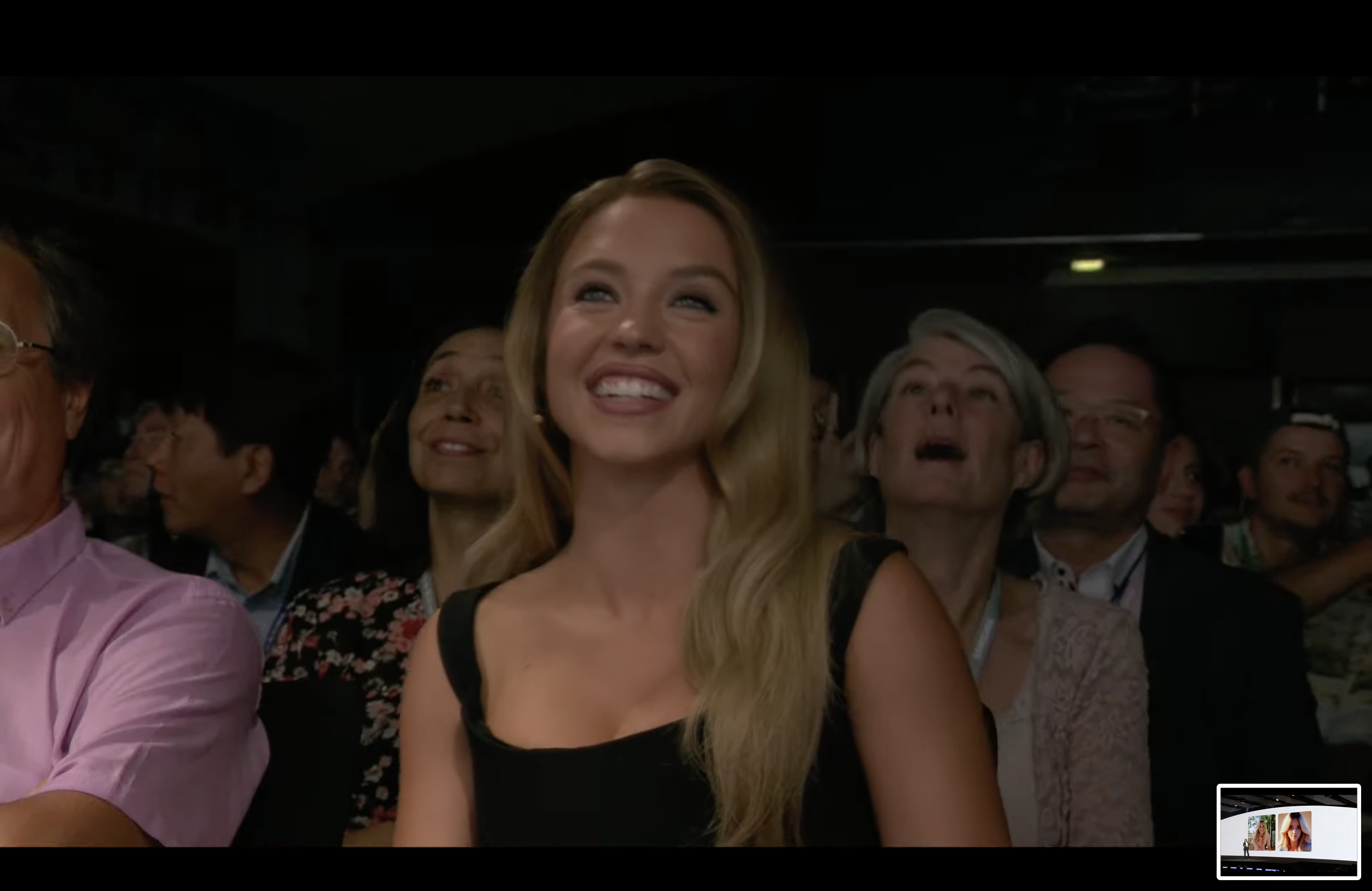 Sydney Sweeney beaming in the audience of Samsung Unpacked 2024.