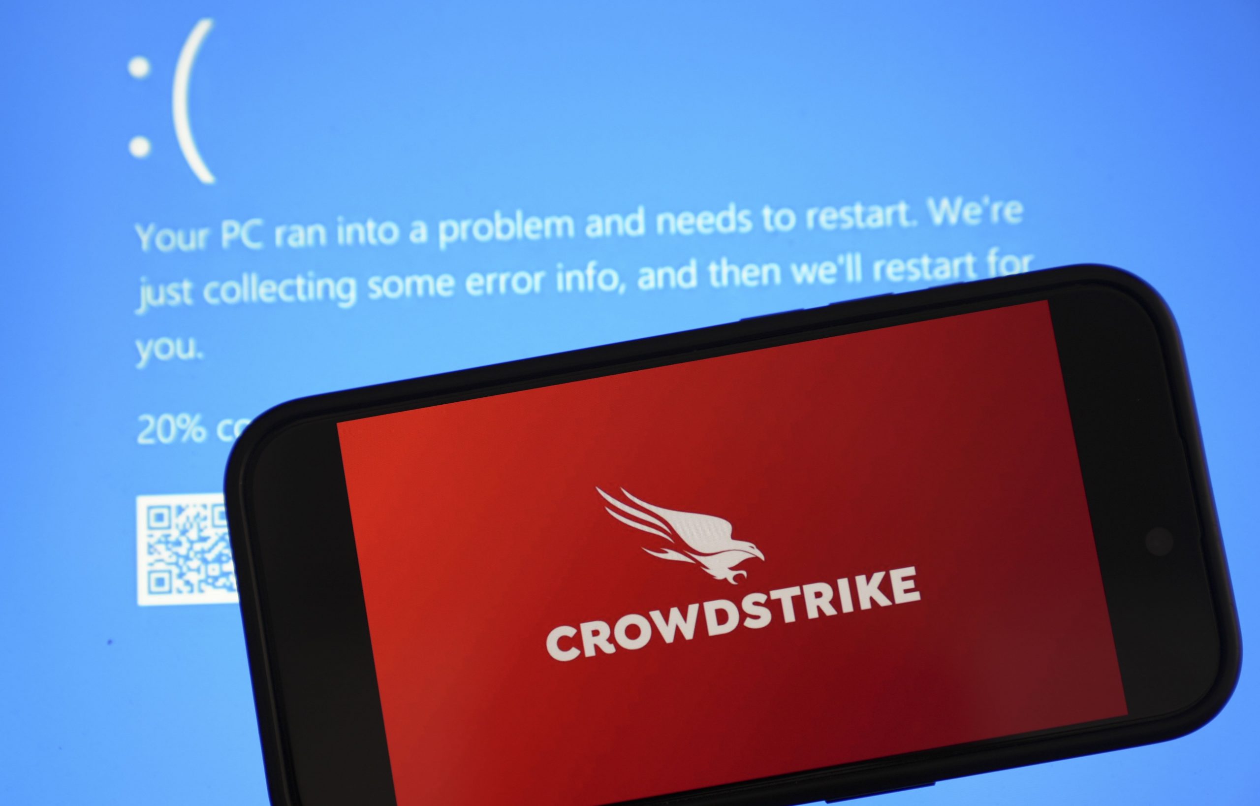 CrowdStrike logo over the Microsoft Windows blue screen of death