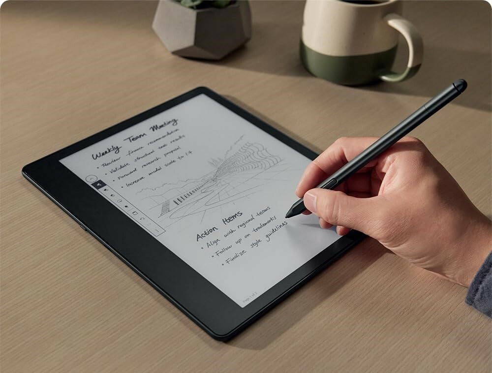 a person writes on the amazon kindle scribe with the included pen