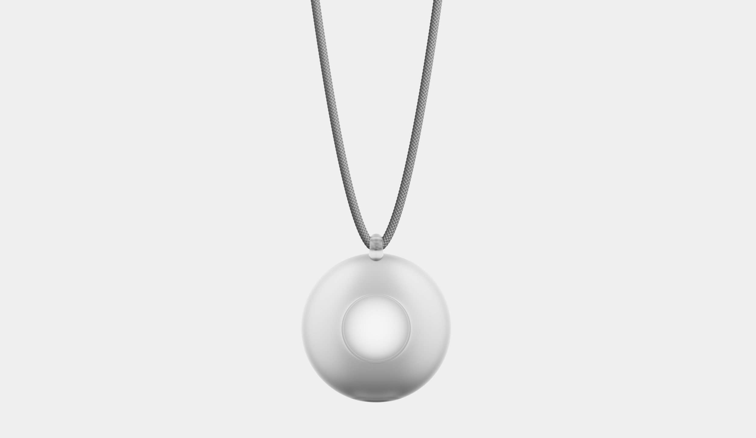 A smooth, round pendant with a small loop at the top, suspended from a textured, gray cord.