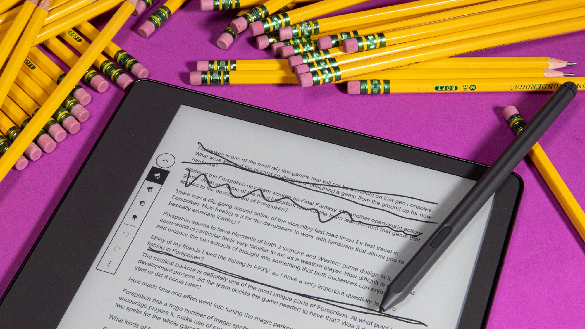 a kindle scribe with note-taking stylus and pencils