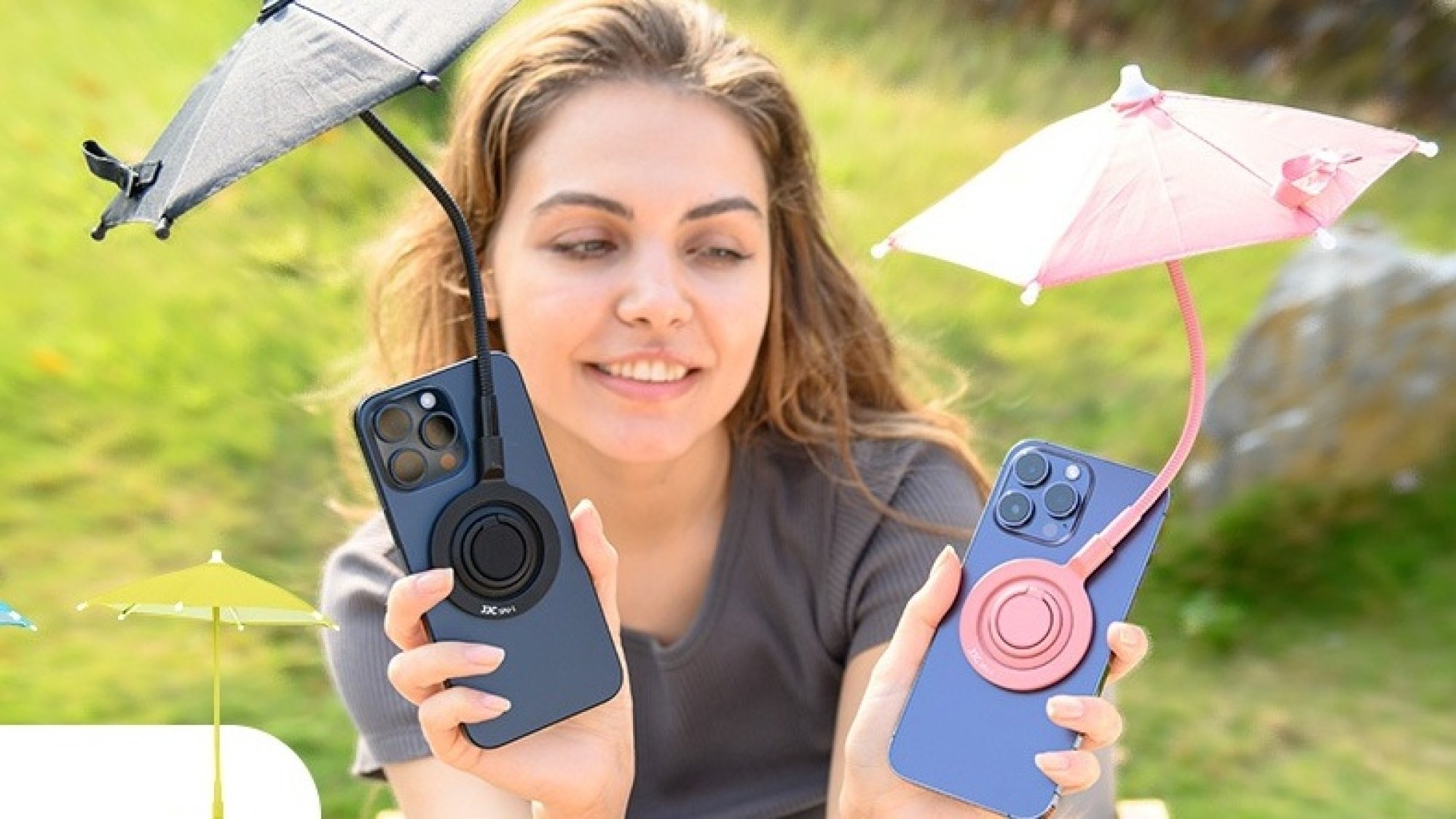 Woman holding two iPhones and two iPhone umbrellas