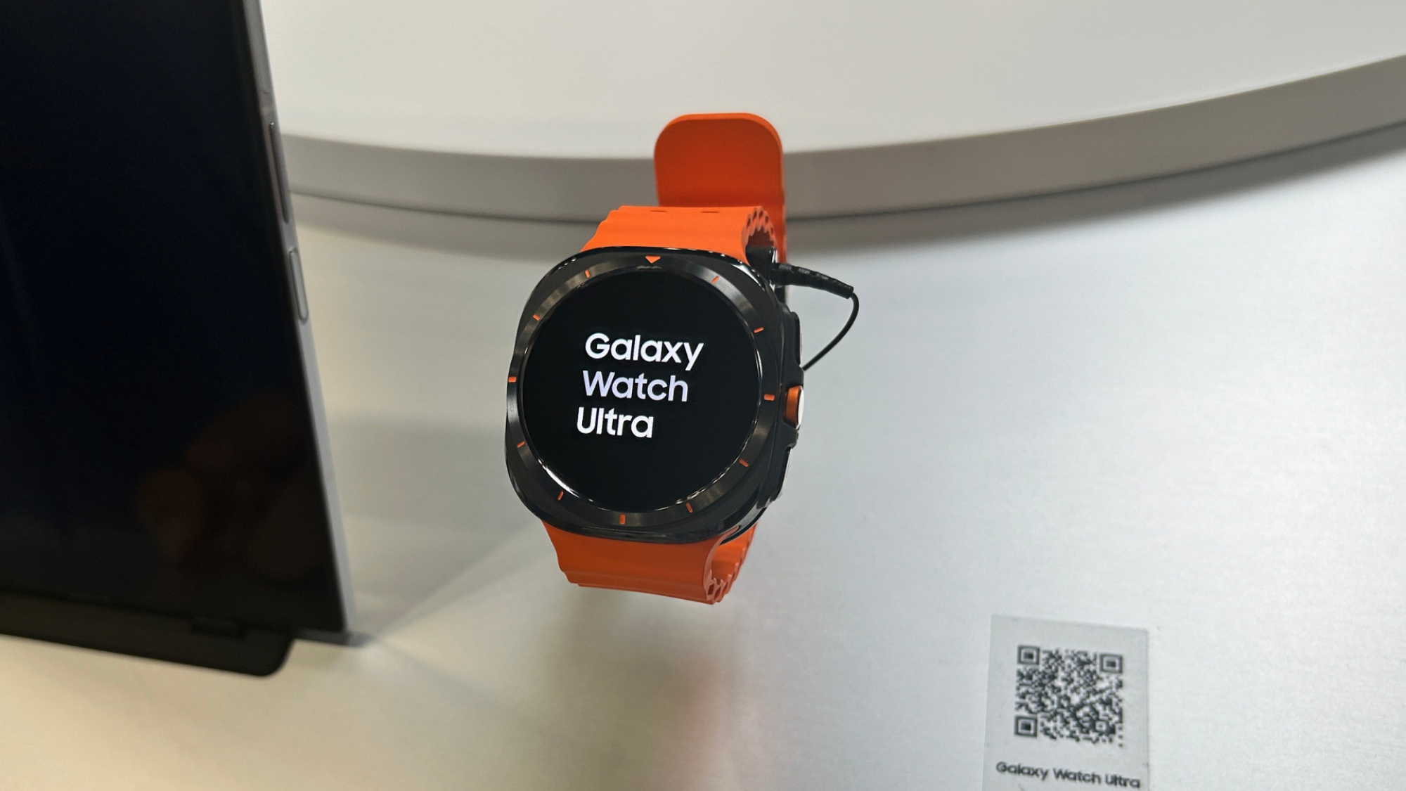 A Samsung Galaxy Watch Ultra being modeled on a table