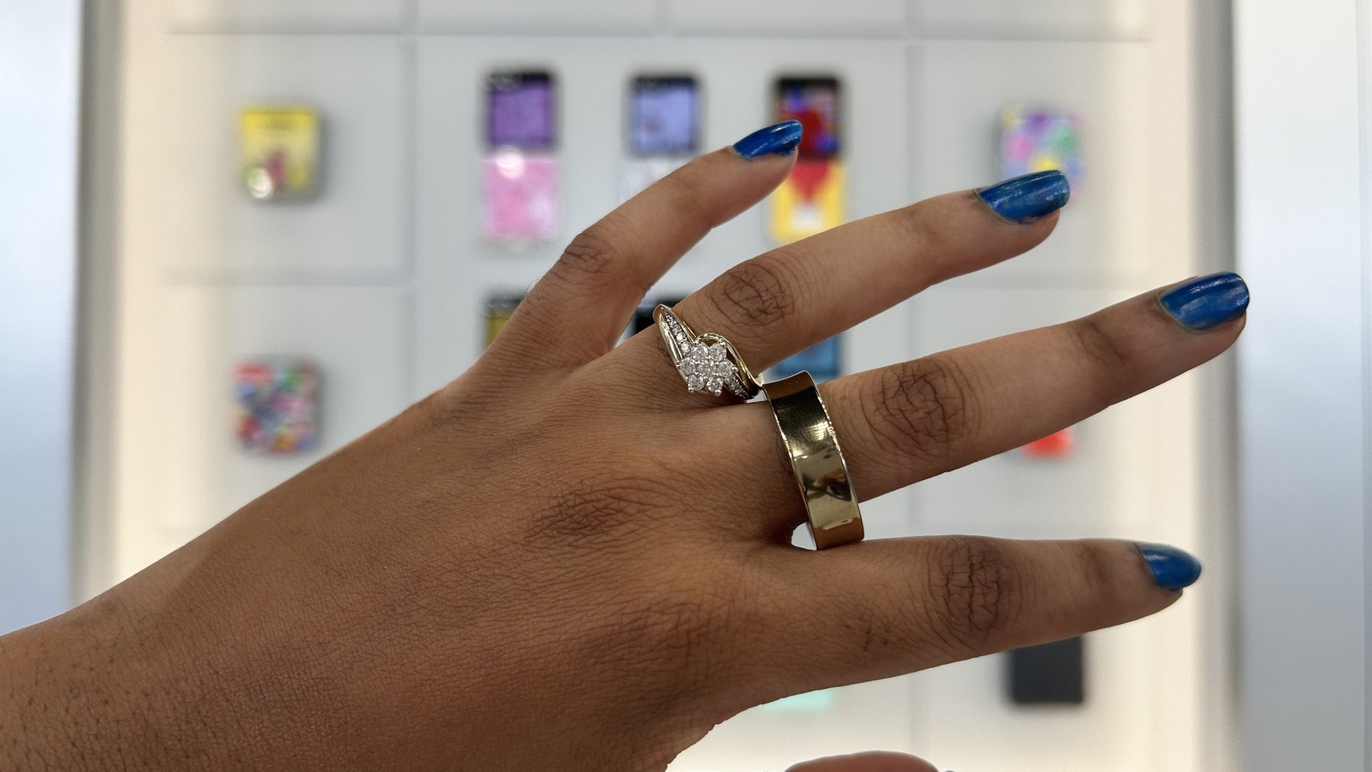 Woman wearing Samsung Galaxy Ring along with her wedding ring