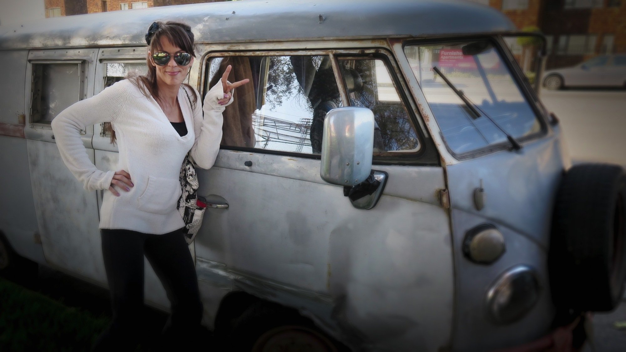 Amanda Antoni poses outside a van. 