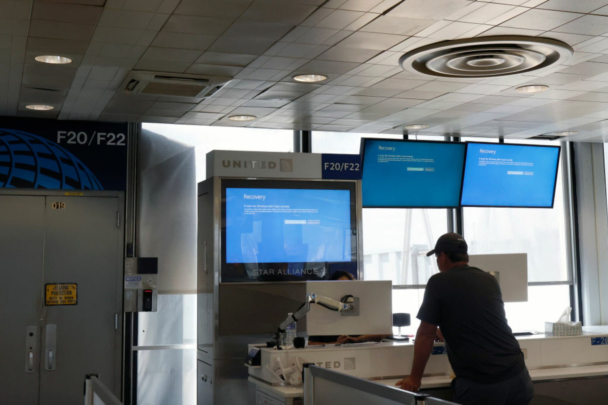 CHICAGO, ILLINOIS - JULY 19: Flight information screens display a recovery window in the second terminal at Chicago O'Hare International Airport on July 19, 2024 in Chicago, Illinois.