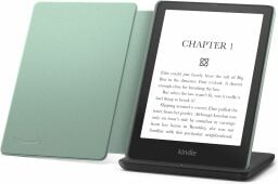 A Kindle Paperwhite Signature edition with a leather case and wireless charger