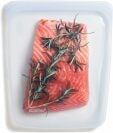 Clear Stasher silicone zipper bag with salmon inside