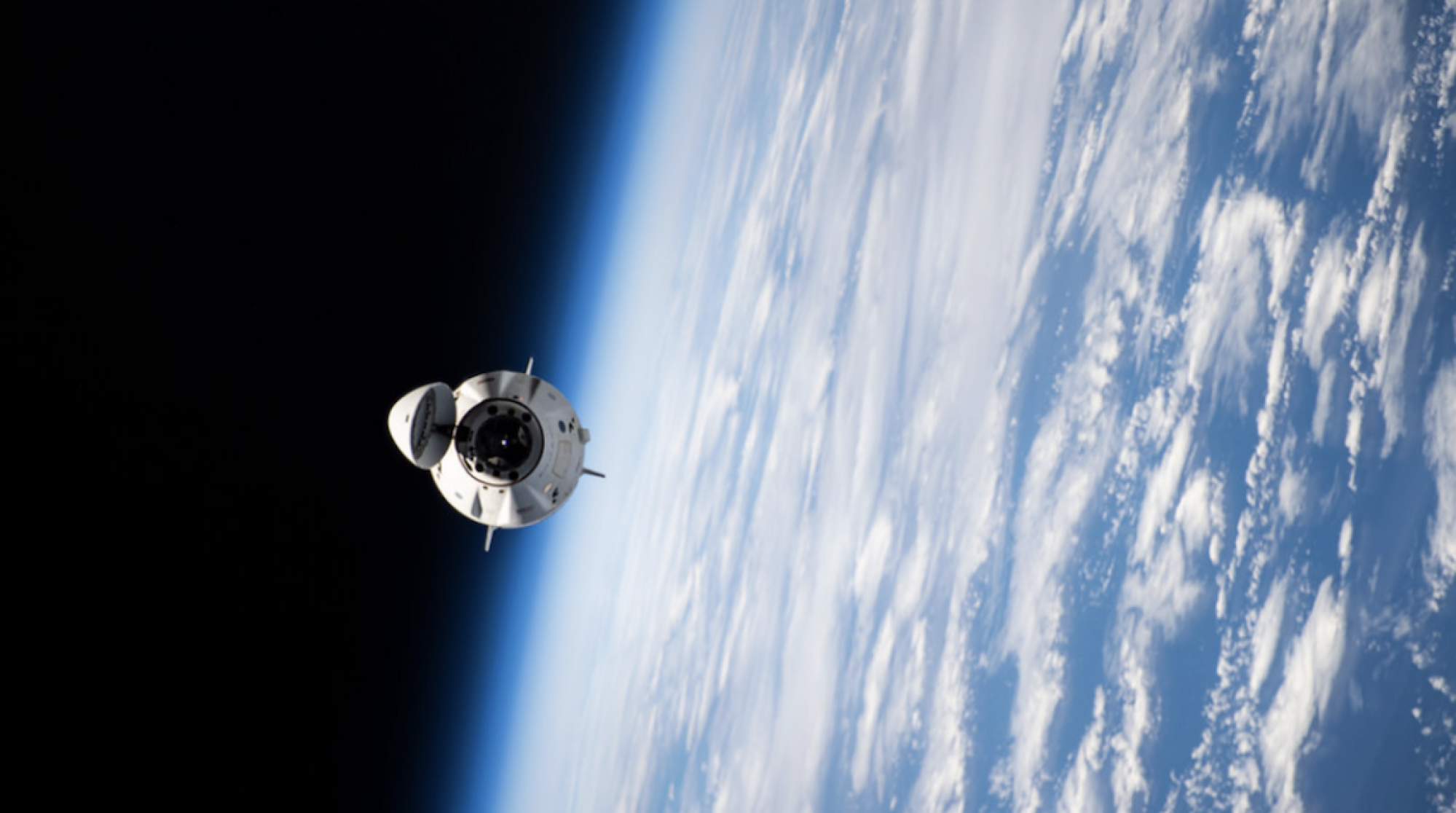 SpaceX's Crew Dragon craft approaching the space station.