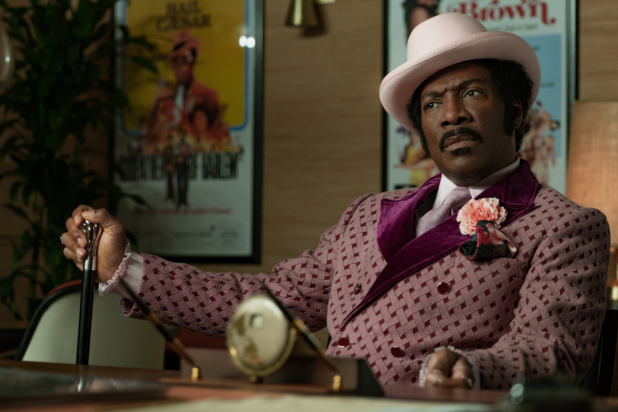 Eddie Murphy as Rudy Ray Moore. 