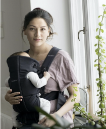 woman wearing black baby carrier