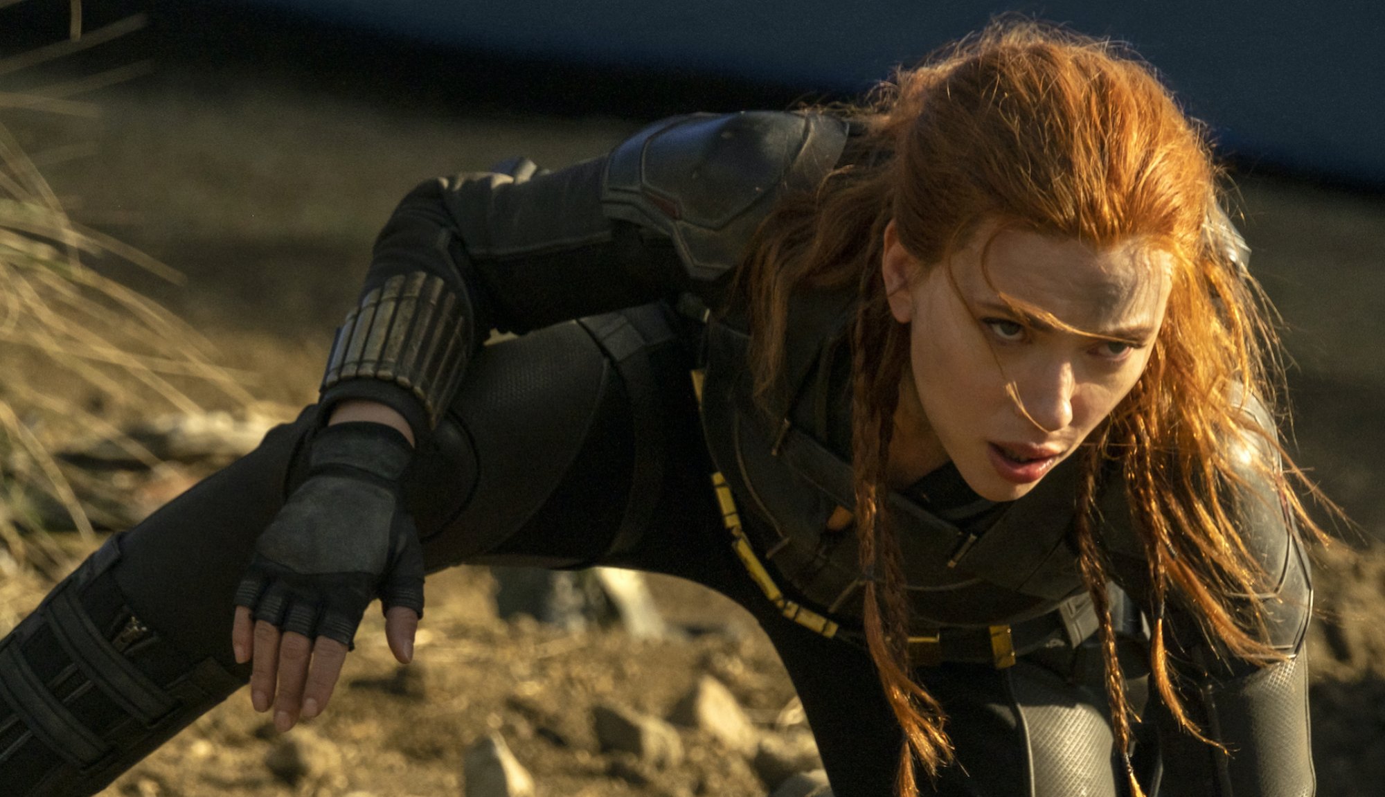 Scarlett Johannson as Black Widow, dressed all in black and mid-combat.