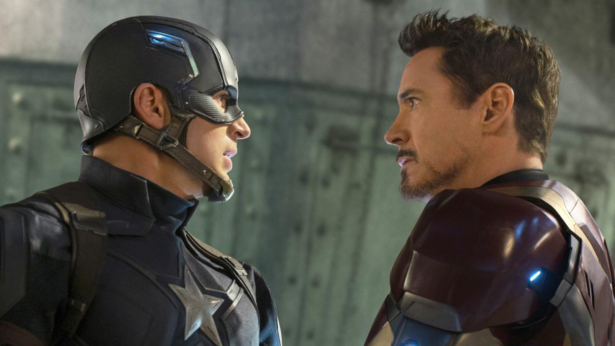 Captain America (Chris Evans) and Iron Man (Robert Downey Jr.) glare menacingly at each other.