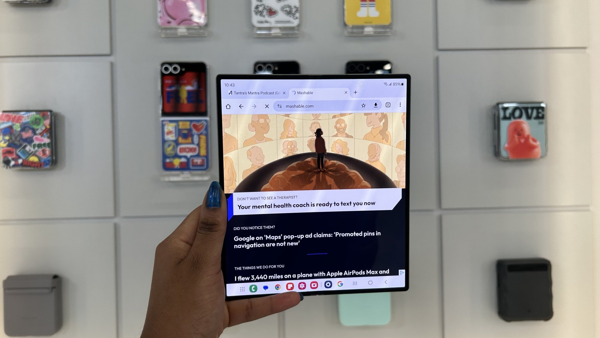 Hand holding Samsung Galaxy Z Fold 6 showing inner display flat 