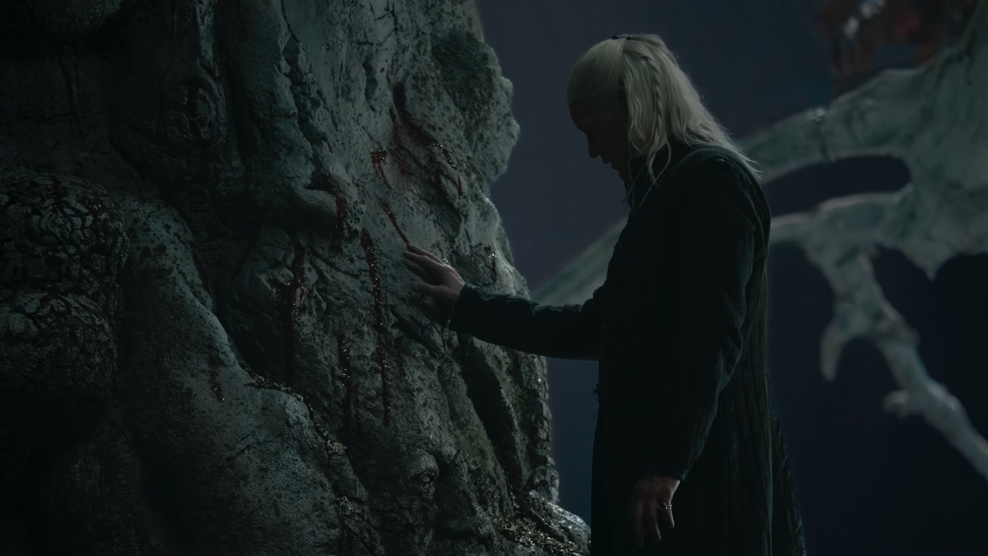 Daemon Targaryen places his hand on the white weirwood at Harrenhal.