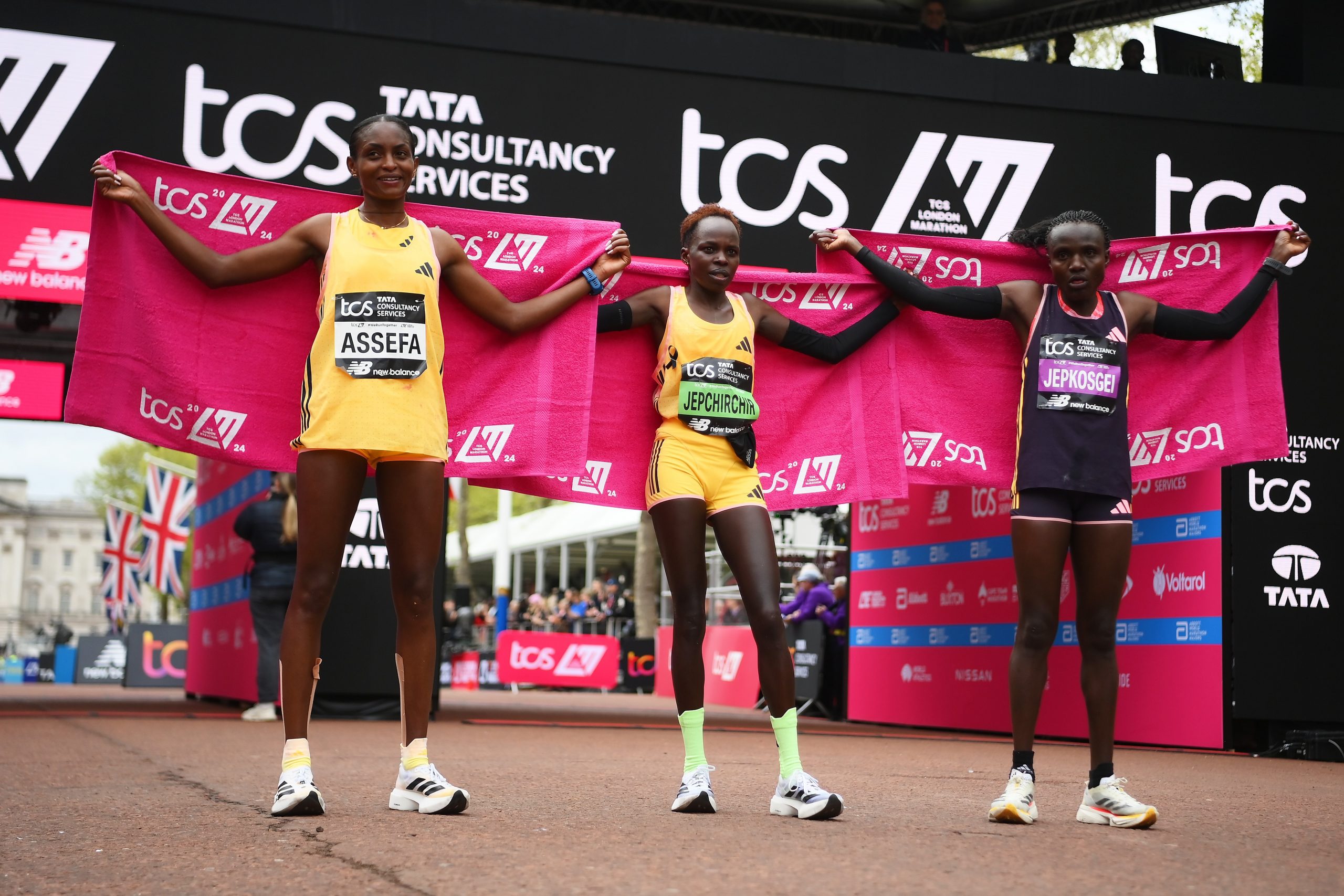 Second placed Tigst Assefa of Ethipoia, first placed Peres Jepchirchir of Kenya and third placed Joyciline Jepkosgei of Kenya celebrate winning the Women's elite race at London 2024