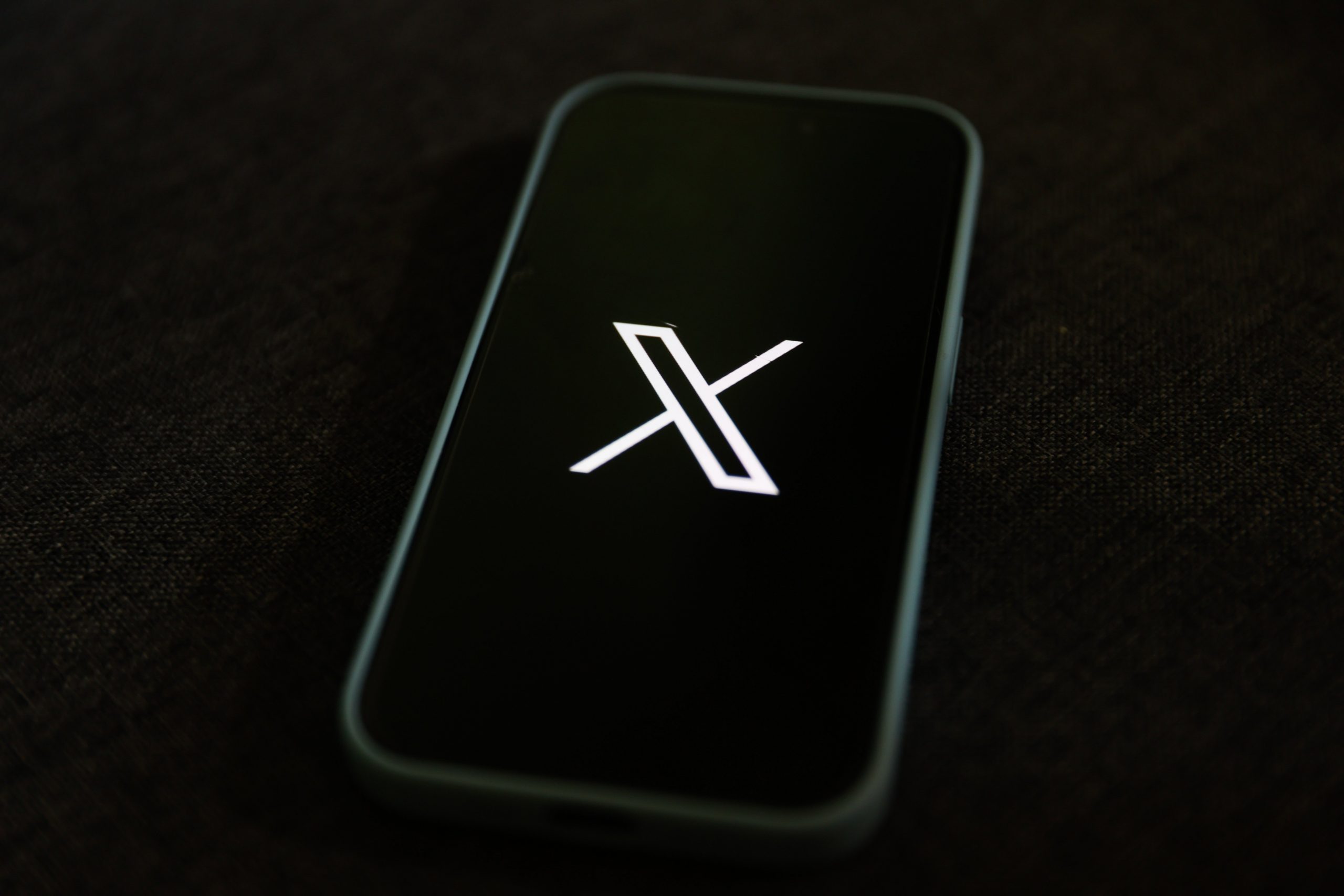 X logo on mobile device