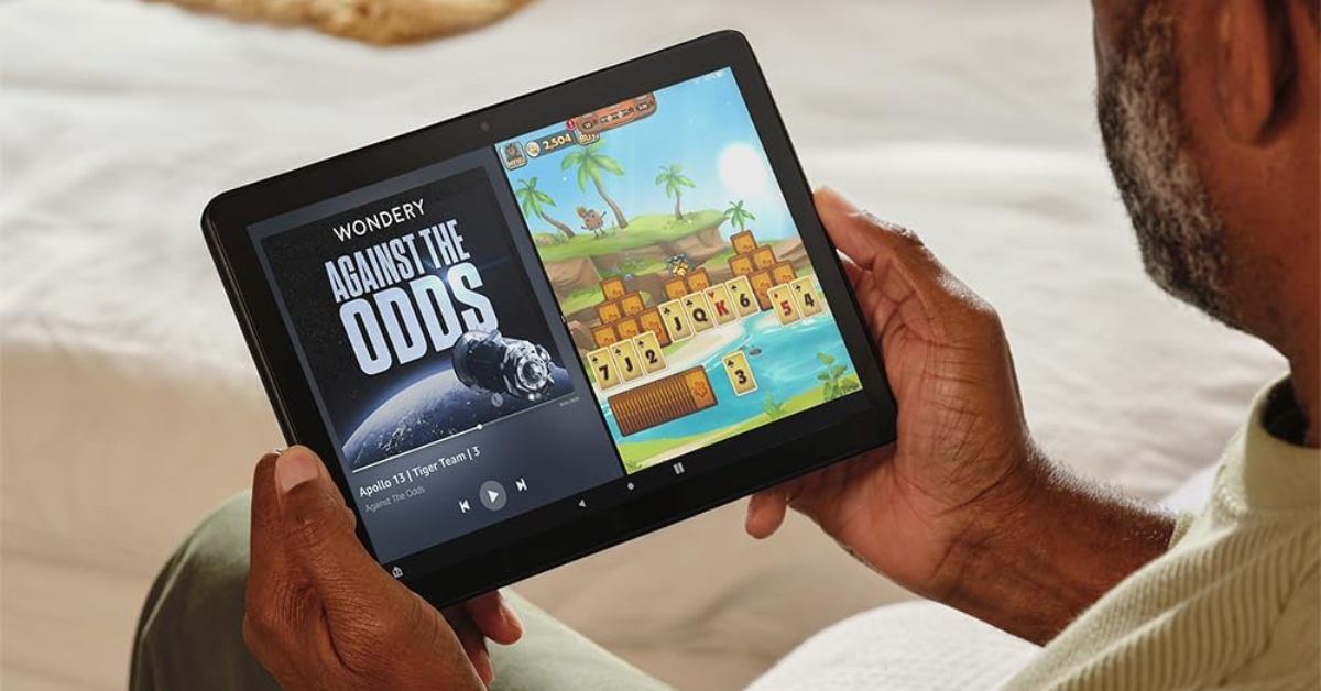 man looking at an Amazon Fire tablet 